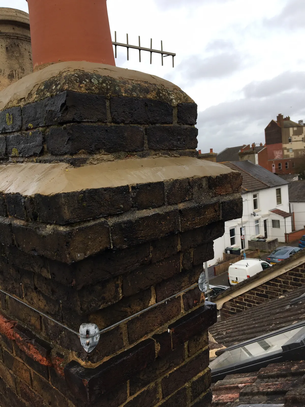 A chimney stack with fresh flaunching around the pots