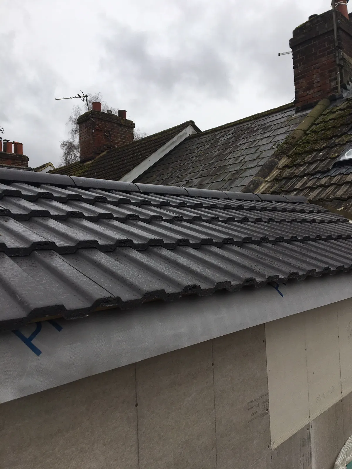 A chimney stack seen from the scaffold, pots and flaunching in view