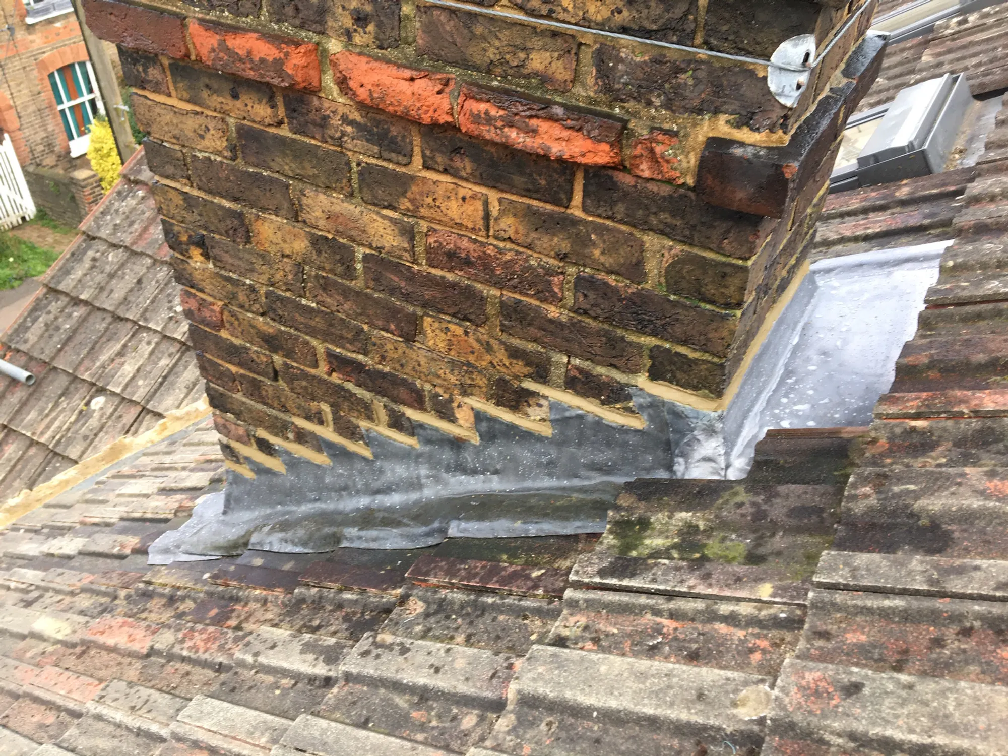 Lead detail dressed against brick and tile