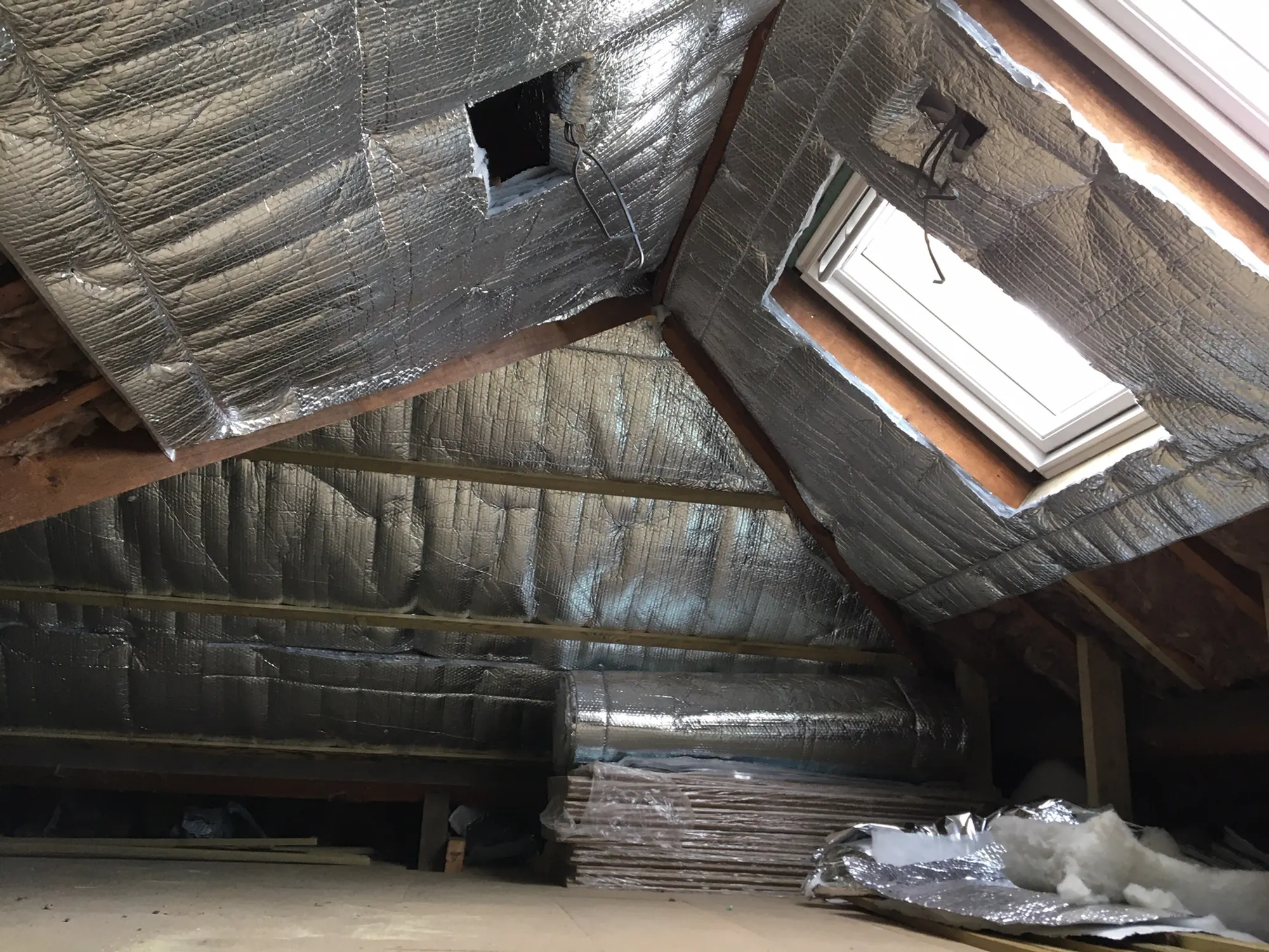 A loft interior, rafters and membrane overhead
