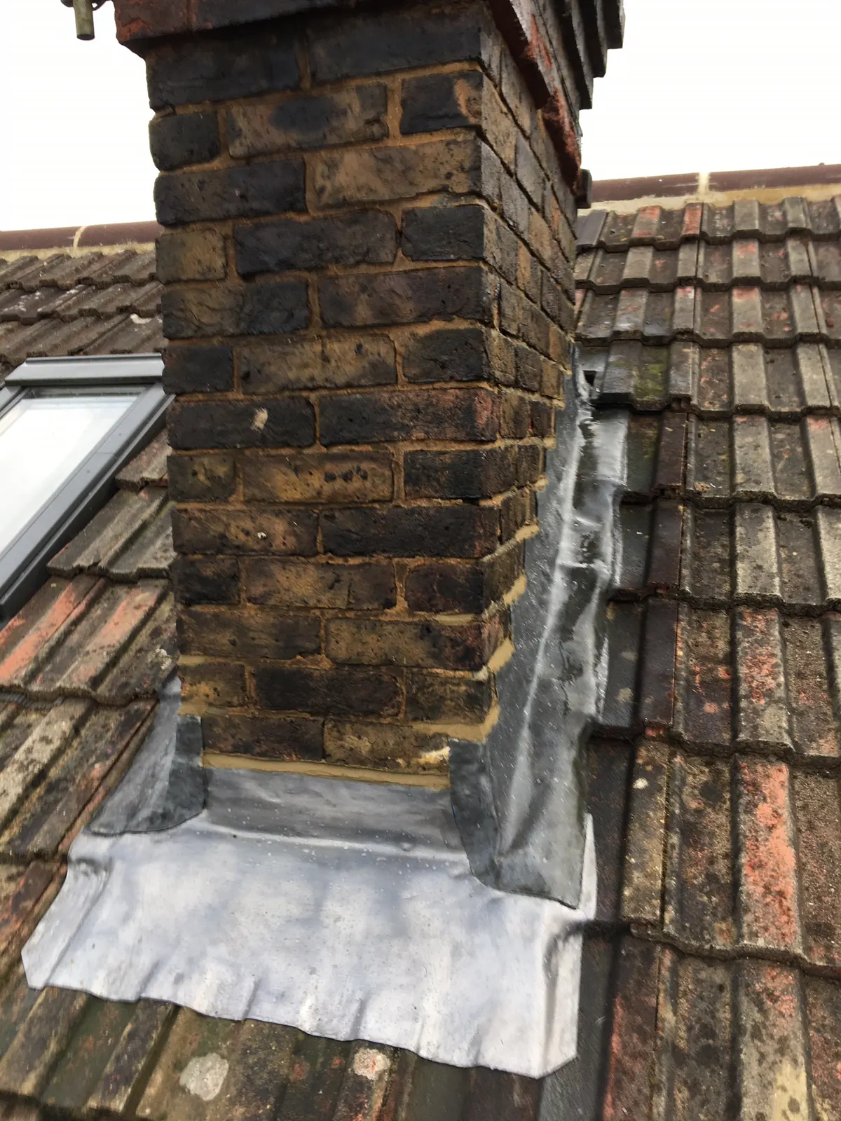 A chimney stack with pots and flaunching