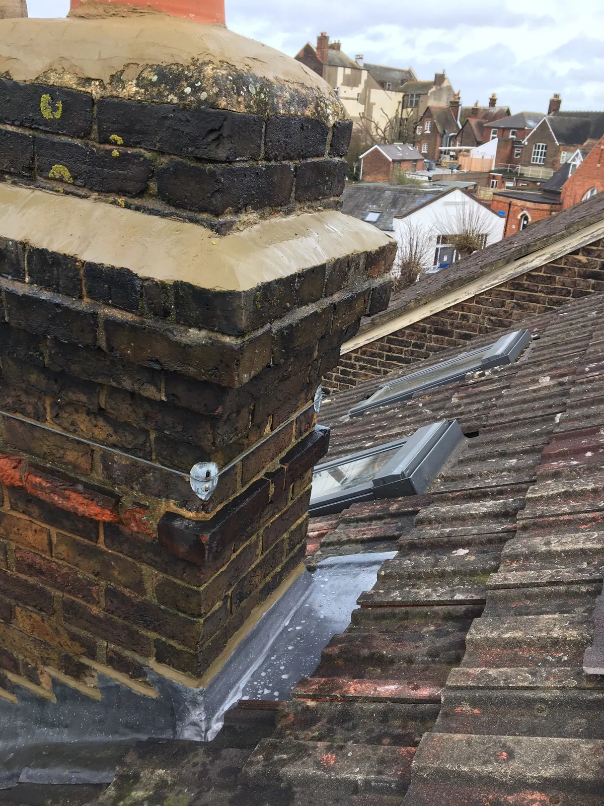A chimney stack with flaunching and pots