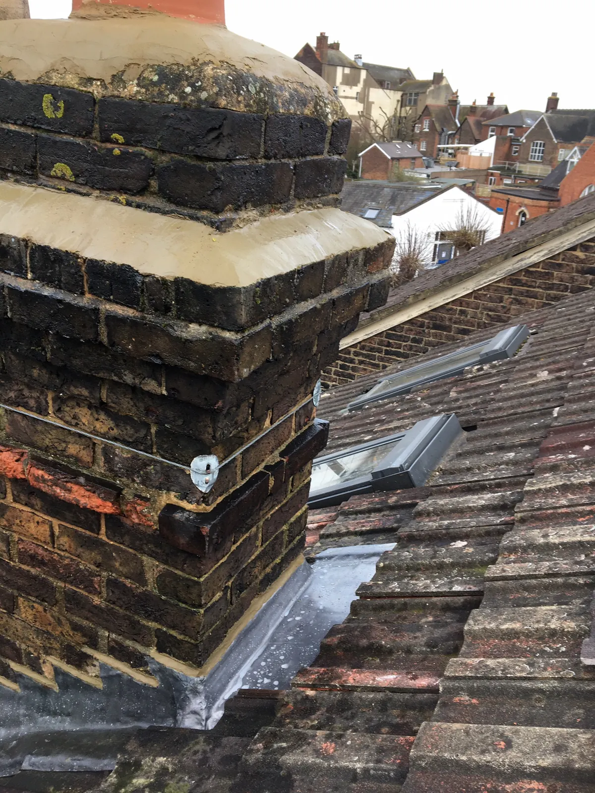 A chimney stack, pots and flaunching